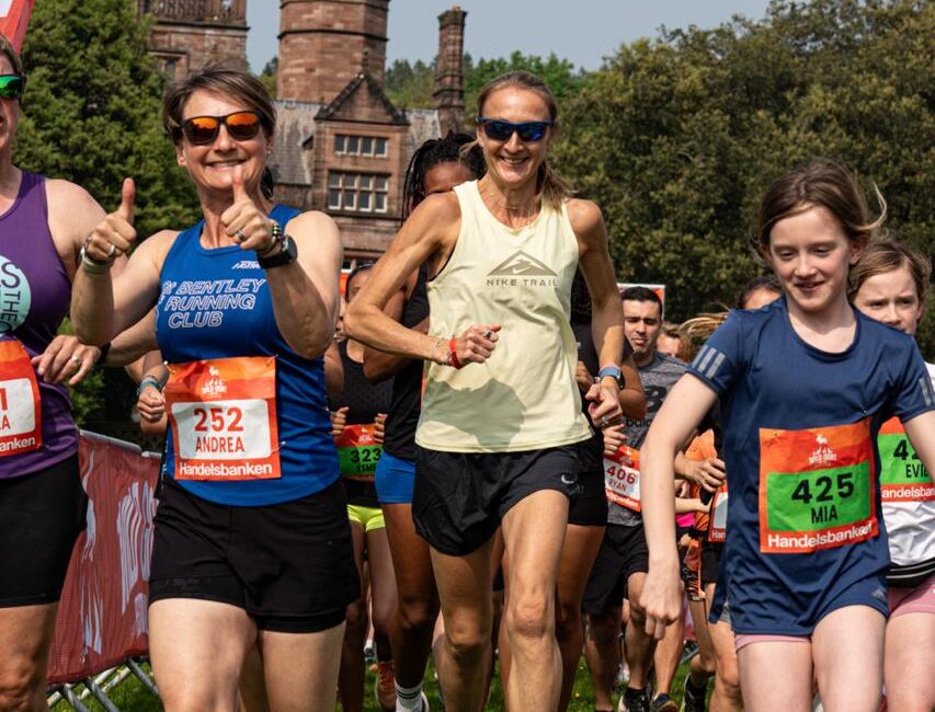 Close up of runners in front of Holker Hall in Cumbria.